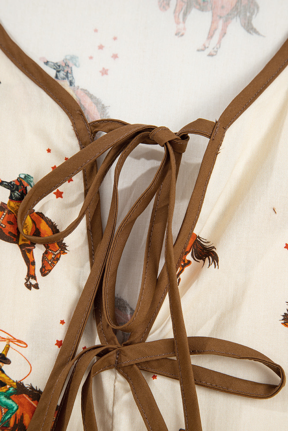 Blouse imprimé cowboy, manches bouffantes, nœud, péplum — abricot