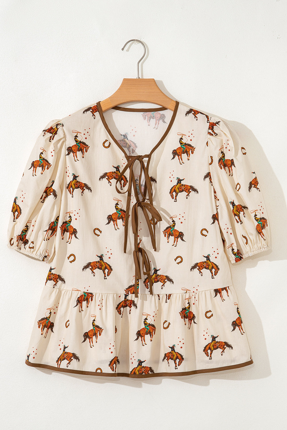 Blouse imprimé cowboy, manches bouffantes, nœud, péplum — abricot
