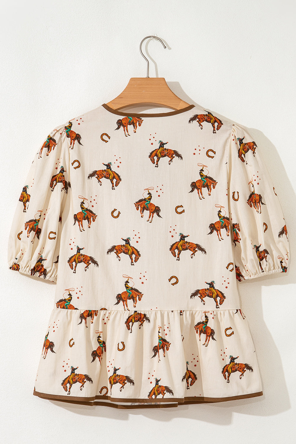 Blouse imprimé cowboy, manches bouffantes, nœud, péplum — abricot